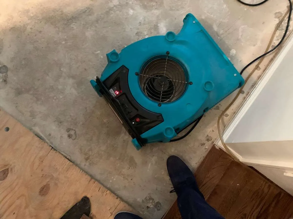 Air mover drying subfloor during Commercial Water Damage Restoration in Burlingame